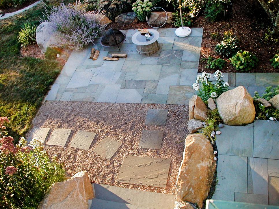 Stone Walkway and Patios With Fire Pit and Large Rocks