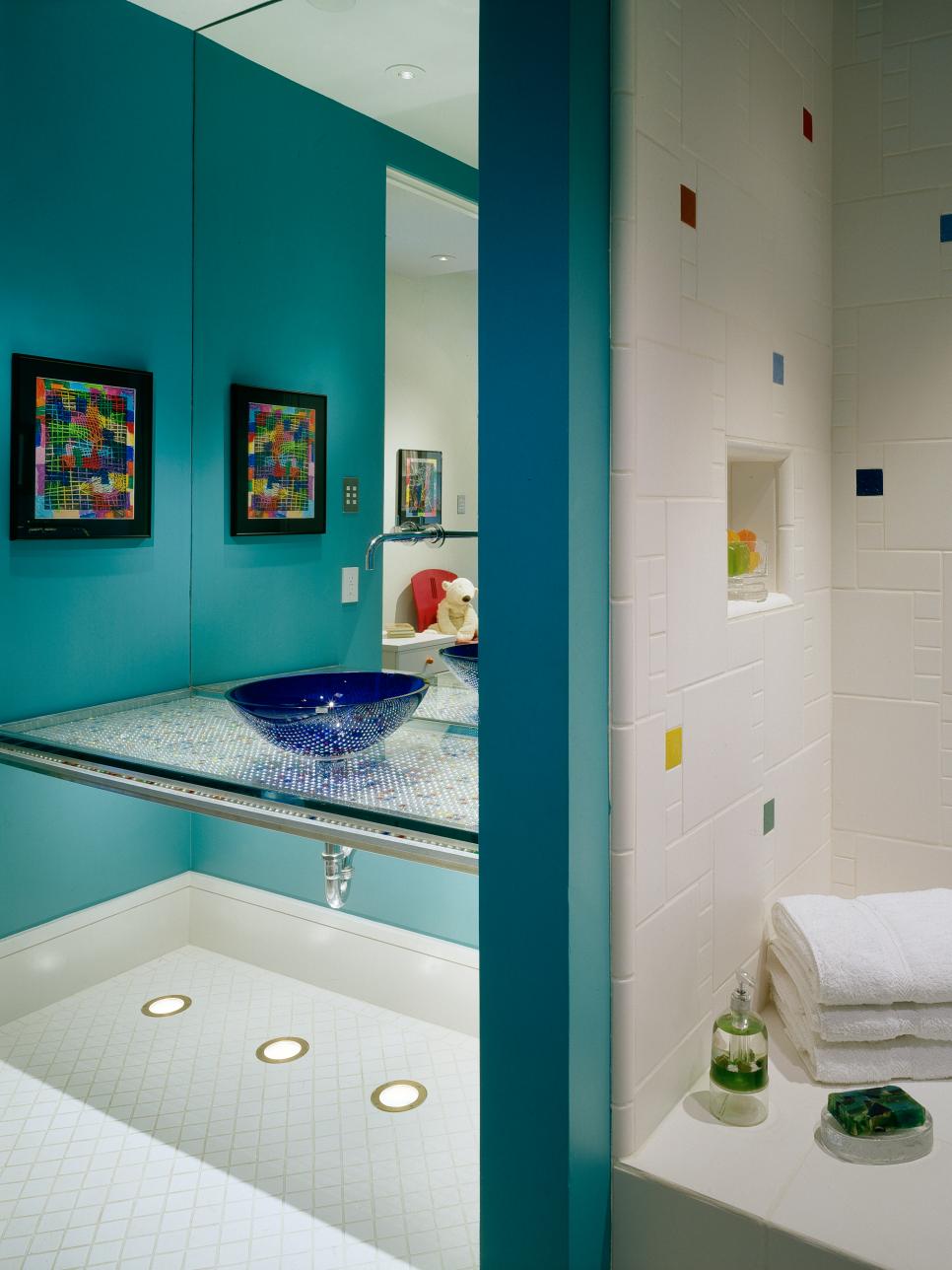 Blue Kids' Bathroom With Floating Vanity and Tiled Shower