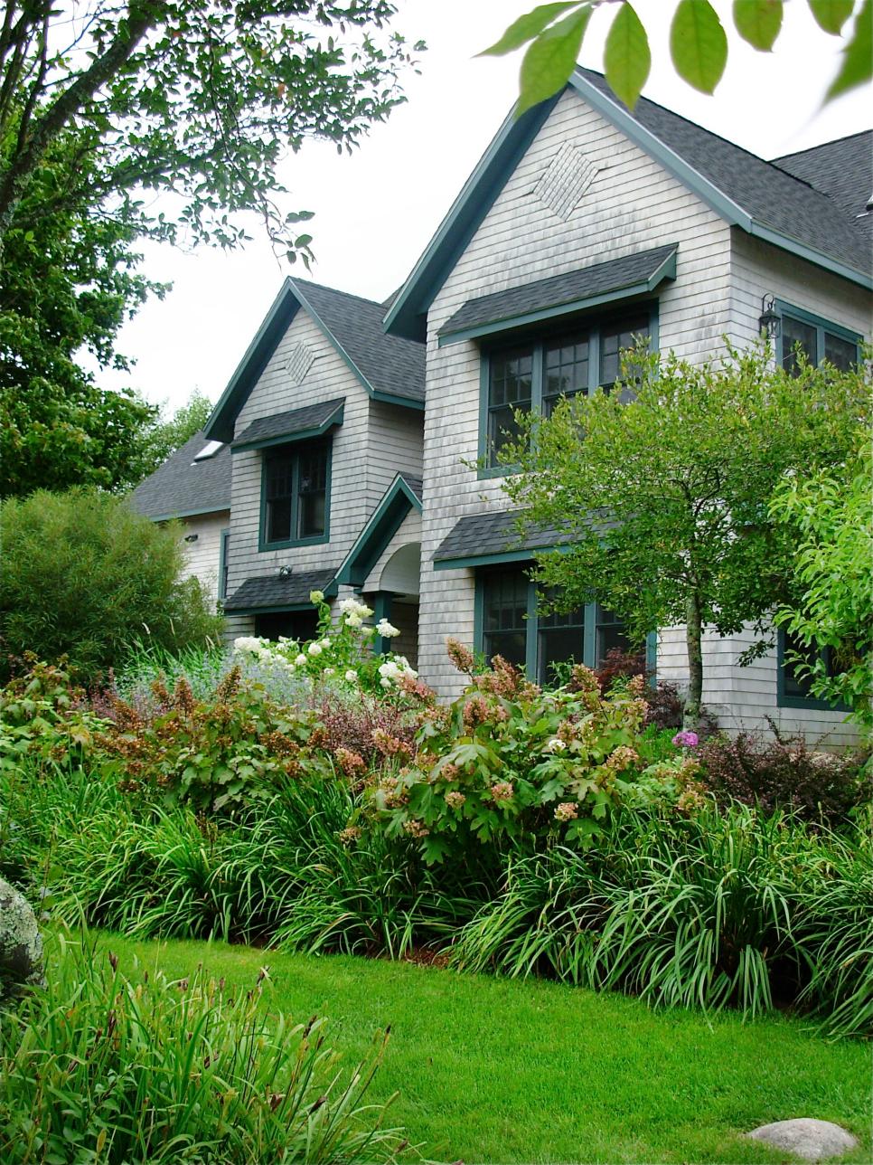 Traditional Home Exterior With Landscaping and Greenery