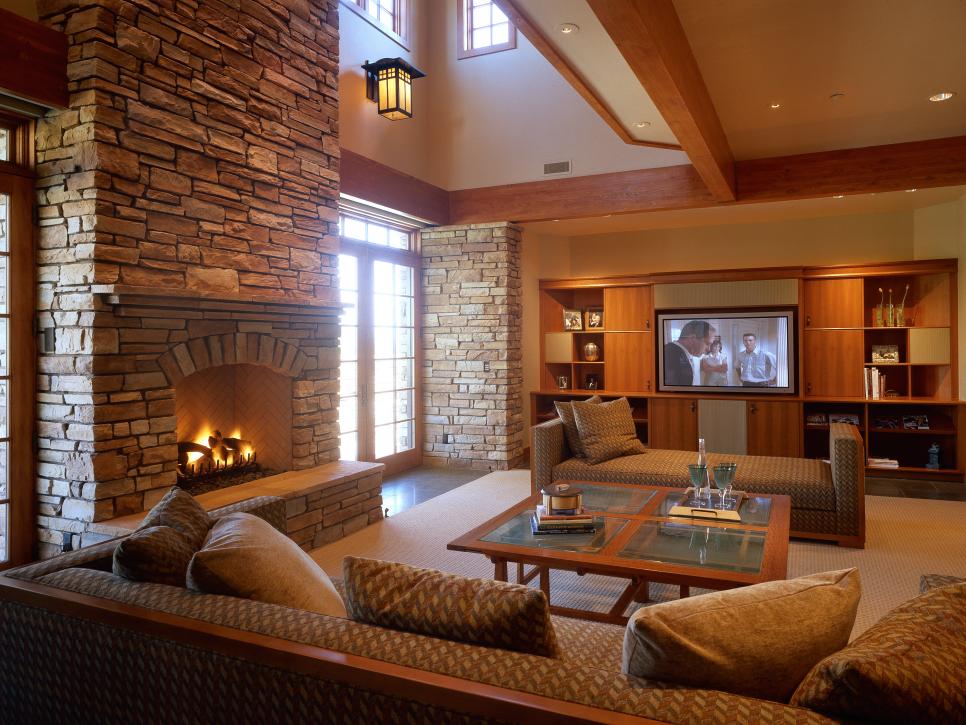 Country-Style Living Room With Exposed Beams and Stone Fireplace