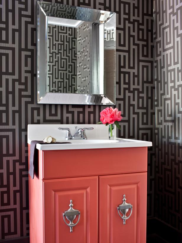 Stylish Bathroom With Graphic Wallpaper and Salmon-Colored Vanity Stylish Bathroom With Graphic Wallpaper and Salmon-Colored Vanity