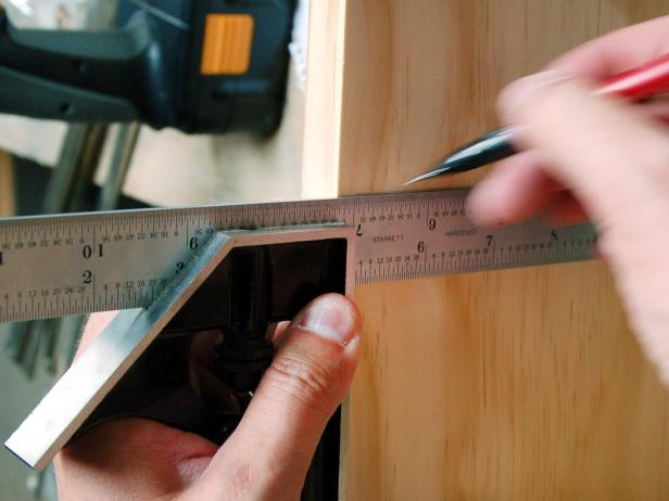 Lay both side pieces flat on a table with insides facing up. Using the diagram as guide, make pencil marks on both pieces of wood where shelves will be attached. Tip: If a power saw is unavailable, bring the lumber list to a local hardware store and have shelves cut in-store.