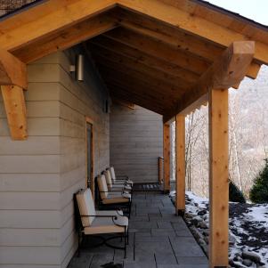 Natural stone patio with wood beams