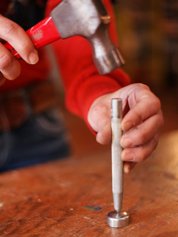 Mark the center of the expansion cap with an awl before drilling a hole for the dowel.
