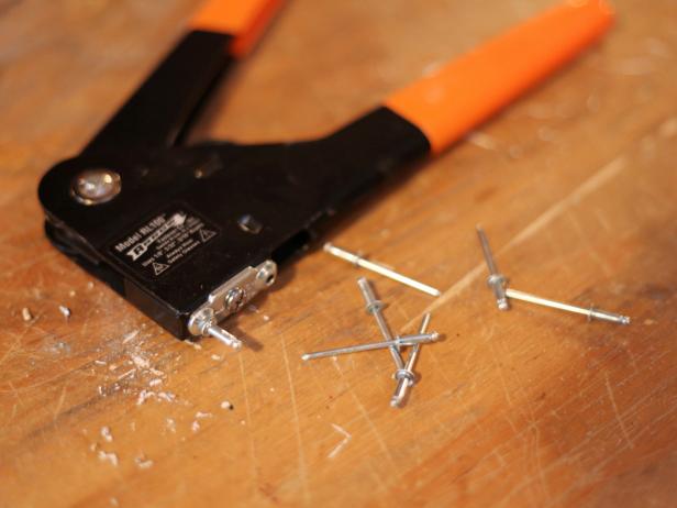To attach buckle, center back on board, mark holes and drill through board. Use rivet tool to attach buckle back with rivets.