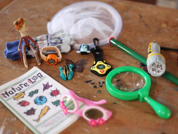 Fill Backpack With Kids' Outdoor Tools Collection of Kids' Outdoor Gadgets