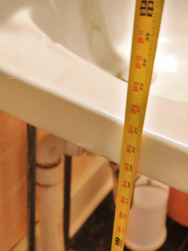 Tape Measure Measuring Height of Sink