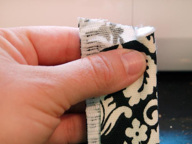 Wrap fabric length around piping cord.