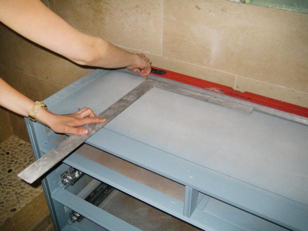 Mark the vanity's subtop for the sink cutout, using the sink's installation guide for the exact size.