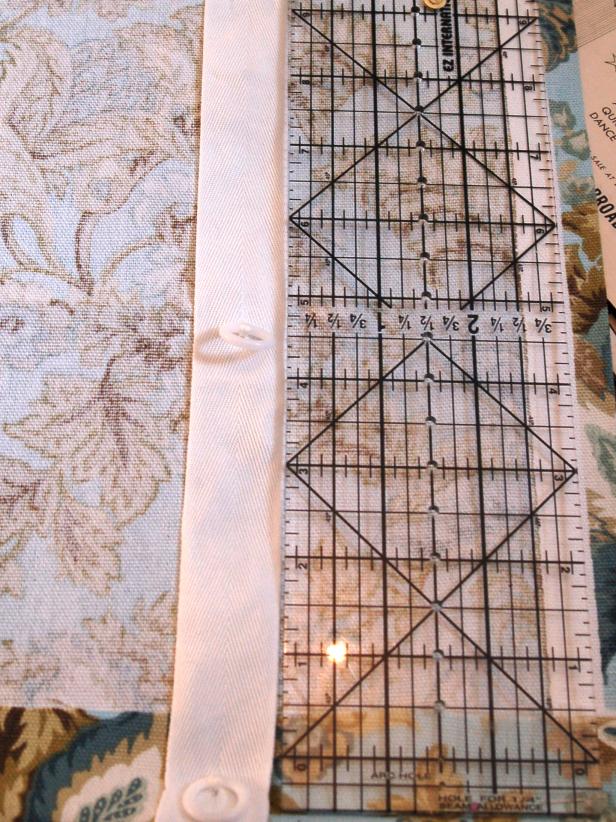 Fold under the bottom edge of the fabric.