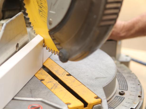 With a chop saw, trim the wood to the appropriate size for the desk.