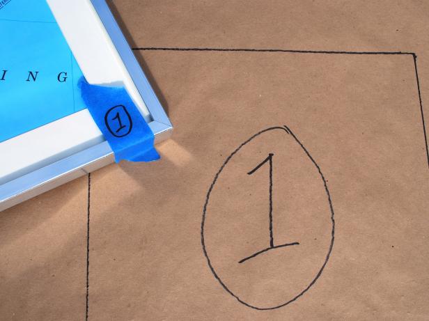 Use tape measure to determine height and width of wall area where map will hang. Jot dimensions down on notepad using pencil. Roll out contractor paper on a long, flat surface. Referring to notepad, mark wall dimensions on contractor paper with marker and level. Arrange frames on contractor paper leaving the same amount of distance between each. Trace frame outlines onto paper with marker, number each frame with a piece of painter's tape and note corresponding numbers on the template.