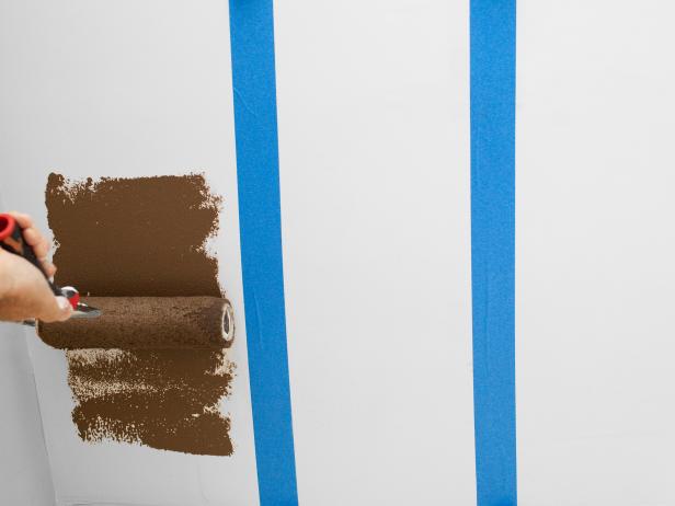 Before painting, protect floor and any furnishings with a drop cloth. Starting from edge of tape, working inward, and paint each taped-off area with accent color. After two coats of first accent color are dry, place a new liner into pan before pouring next color. For side-by-side, two-tone stripes, reposition tape along inside line of completed stripe, then roll between newly positioned tape.