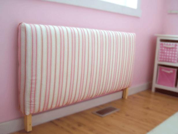 Cover headboard in fabric, stapling in place on the bottom edge.