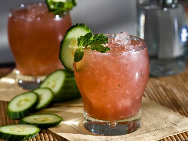 Refreshing Cubama Cocktail with Mint and Cucumber Garnish Refreshing Cubama Cocktail with Mint and Cucumber Garnish