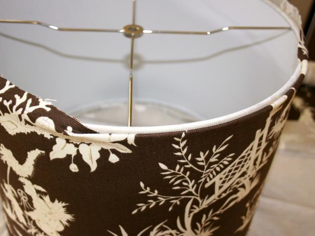 Excess Fabric on Lampshade Edges Being Folded and Tucked Under