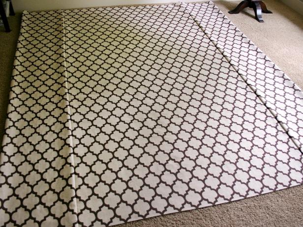 Large Piece of Beige and Brown Patterned Fabric With Ironed Seams