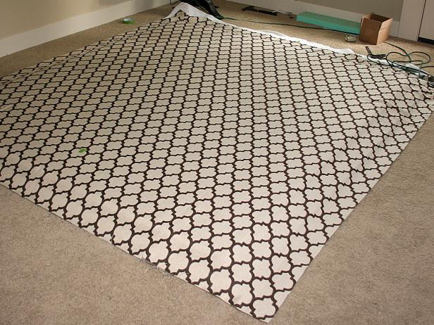 Brown and Beige Patterned Fabric Spread Over Batting