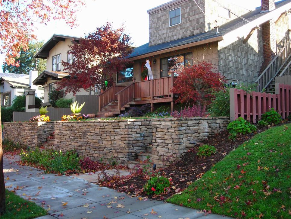 Front Yard With Colorful Landscaping and Gray Stacked-Stone Wall