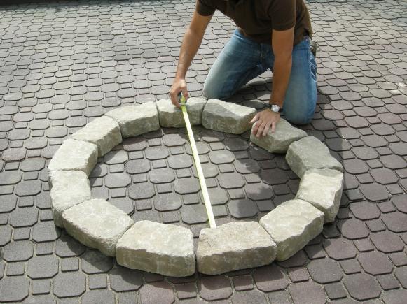 Guy Measuring Firepit Guy Measuring Firepit