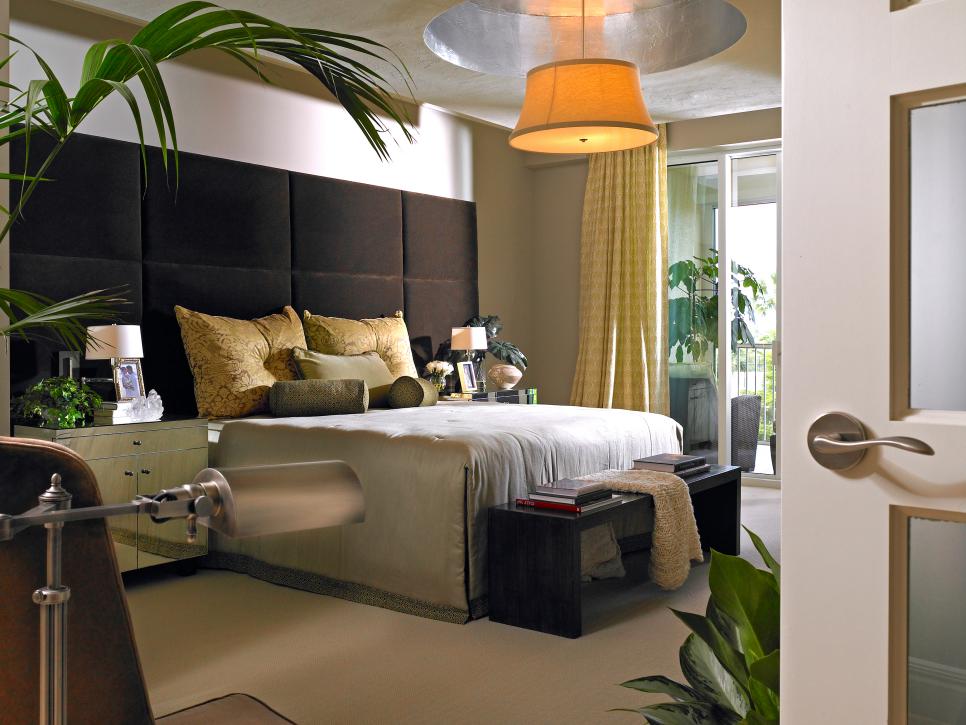 Contemporary Neutral Bedroom With Large Brown Headboard and Pendant Light