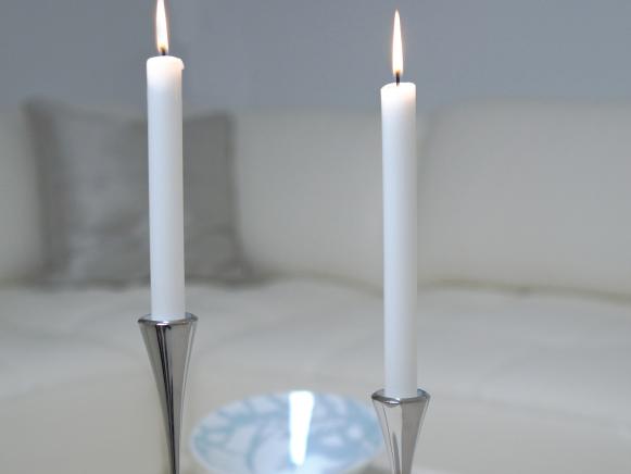 White Candlesticks in Modern Silver Holders White Candlesticks in Modern Silver Holders