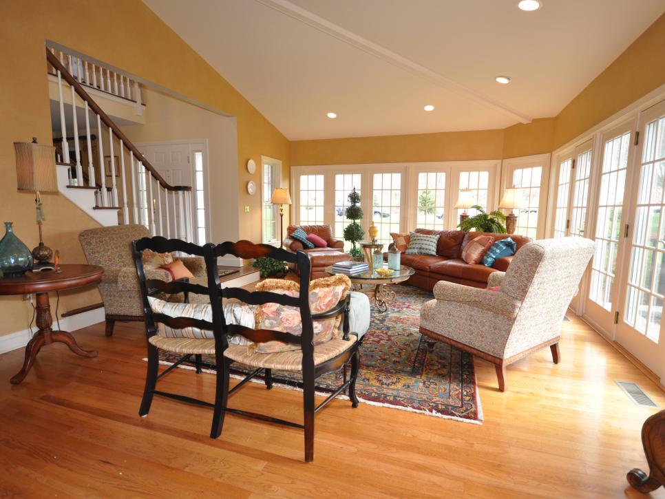 Yellow Family Room With Window-Covered Walls