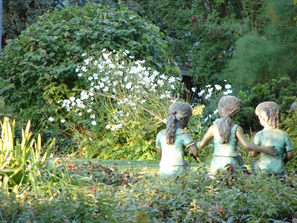 Garden With Statue of Three Girls