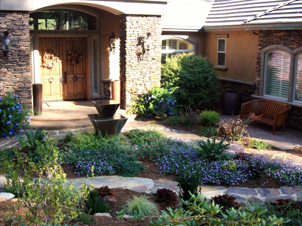 Stone Exterior With Mediterranean Style Garden | HGTV