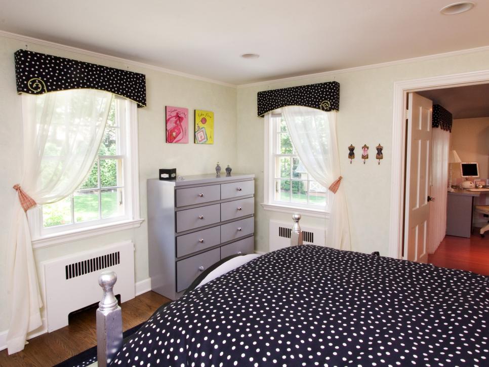 Kid Room With Black and White Polka Dot Bedding and Silver Dresser