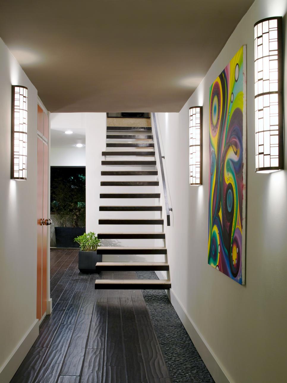 Contemporary Entryway With Floating Stairs Neutral Contemporary Entryway With Floating Stairs and Modern Artwork
