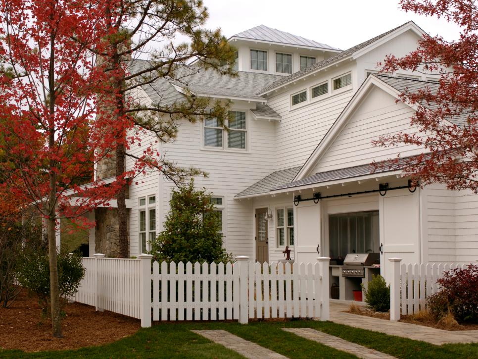 White Farmhouse With Picket Fence Farmhouse With Small Grilling Station