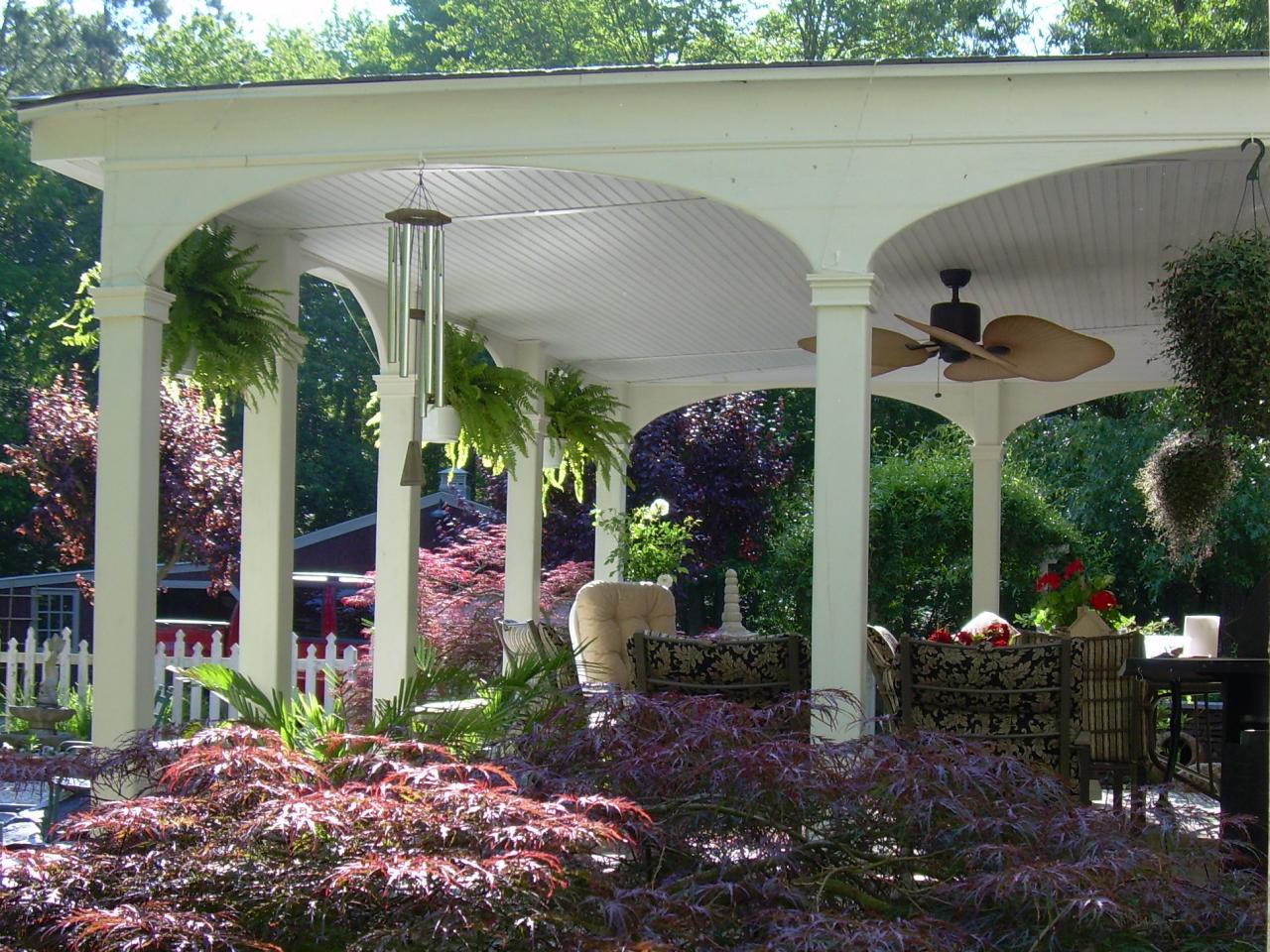 patio overlooking lush garden arches add a classic style to this 