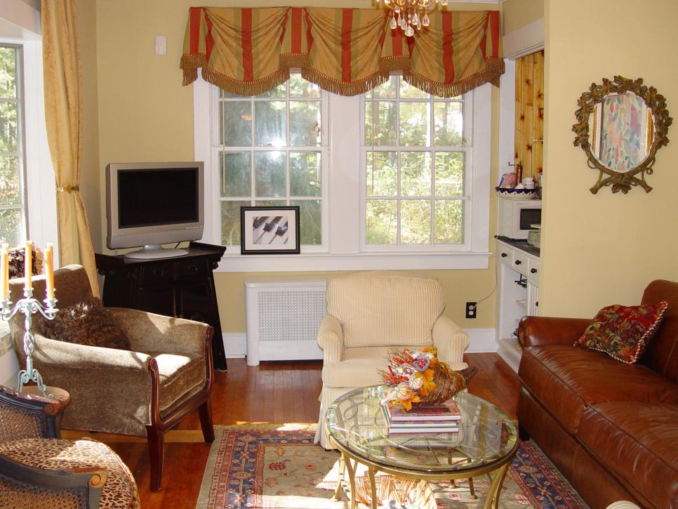 Traditional Family Room With Leather Sofa and Neutral Armchairs