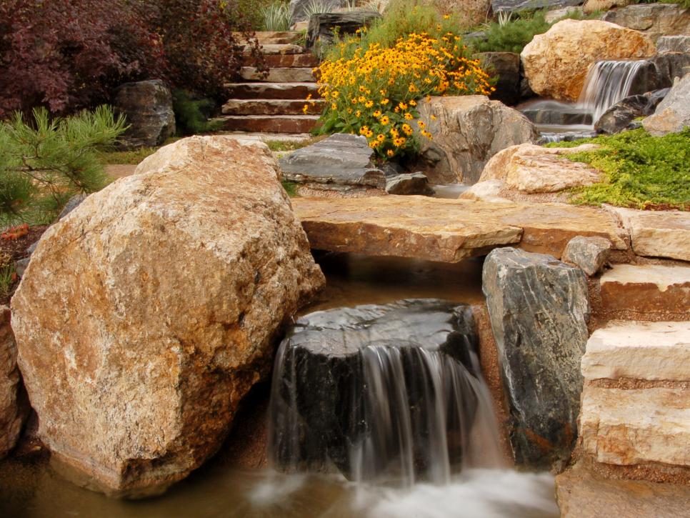 Outdoor Walkway With Boulders and Waterfall