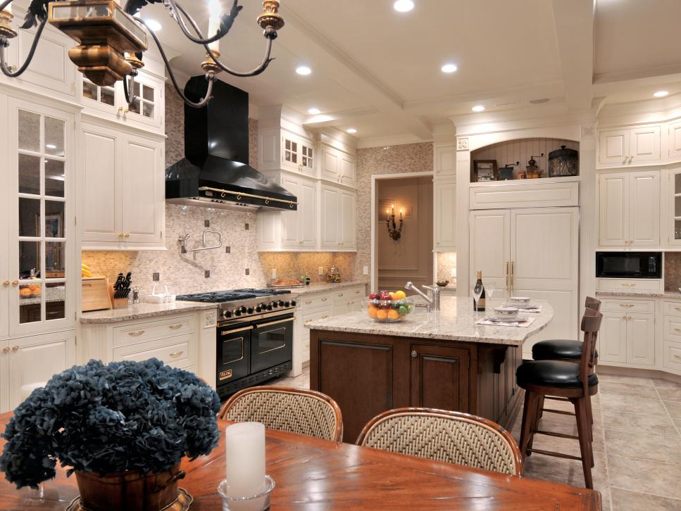 Eat-In Kitchen With Black Range Hood and Traditional White Cabinets