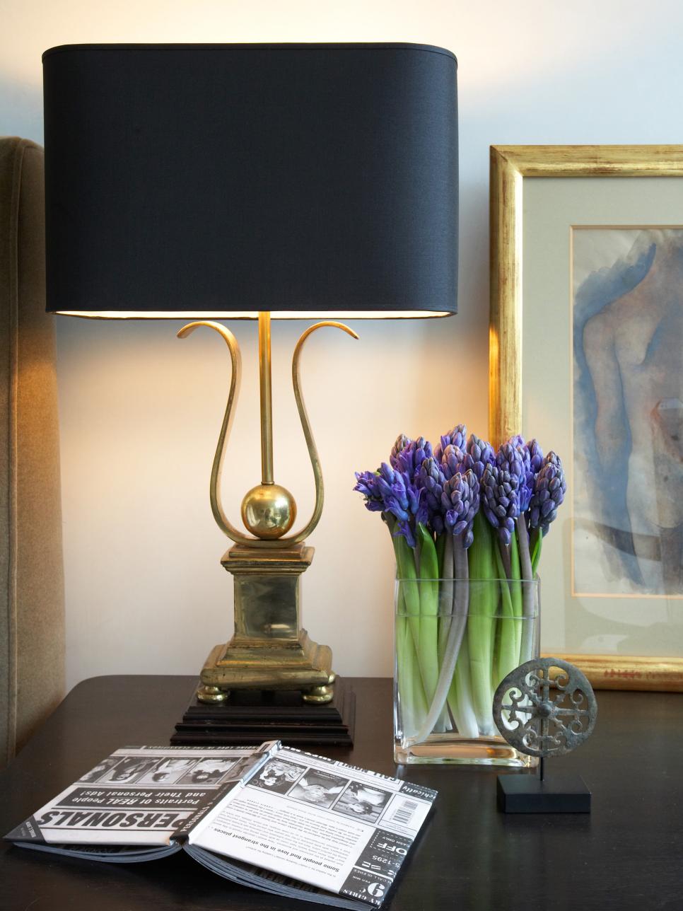 Nightstand With Black and Gold Accessories Black and Gold Lamp on Bedroom Table