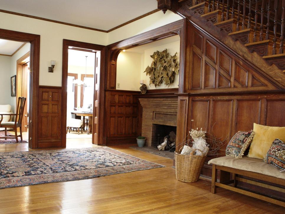 Wood Paneled Foyer with Fireplace and Modern Art