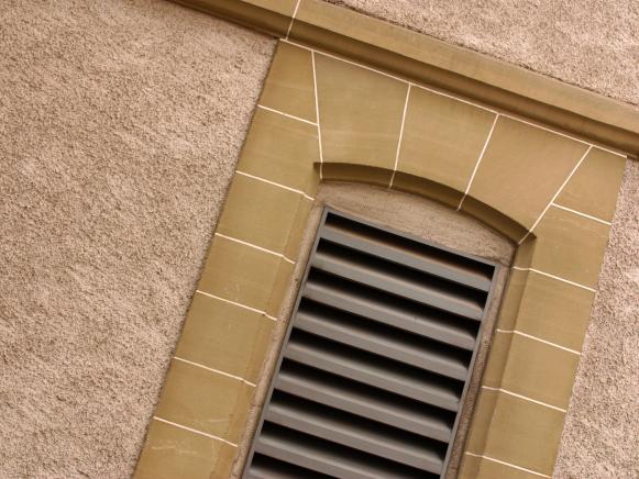 Stone Framed Wall Vent on Stucco Exterior Stone Framed Wall Vent on Stucco Exterior