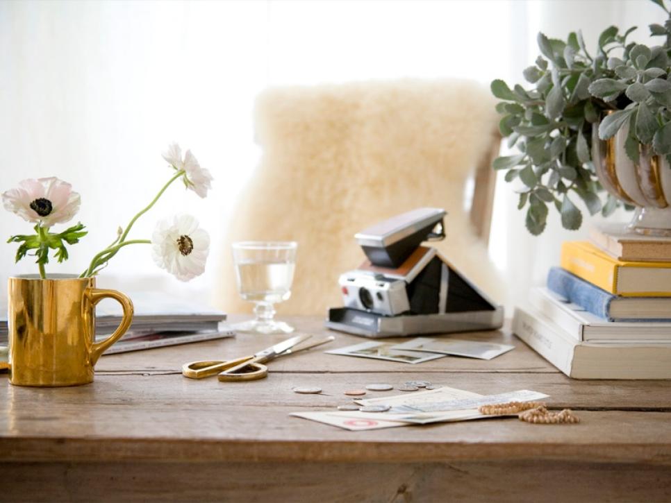 Wood Desk With Books, Mug of Flowers and Polaroid Camera