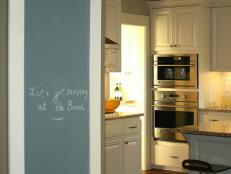 Kitchen With White Cabinets and Family Message Center 