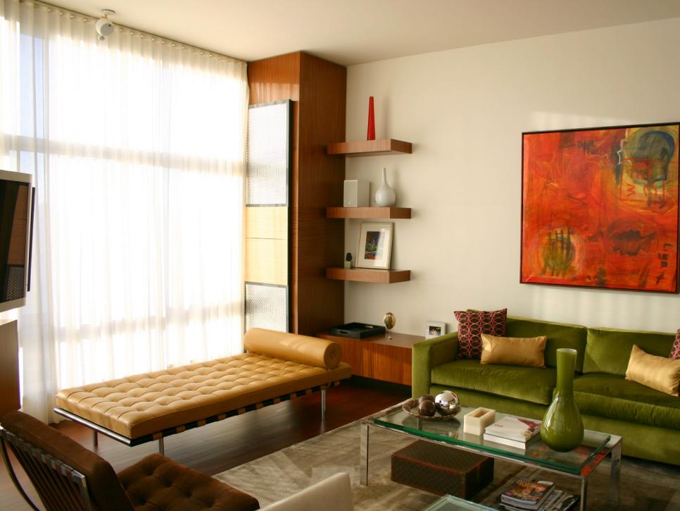 Mid-Century Modern Living Room With Green Velvet Sofa and Leather Chaise