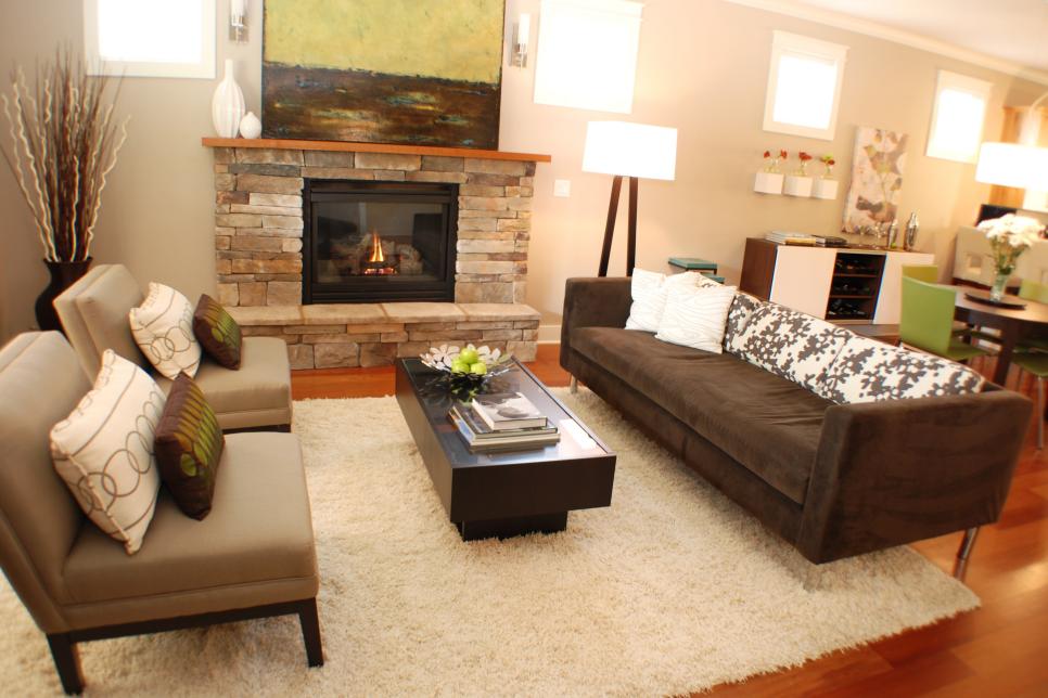 Neutral Modern Living Room With Stone Fireplace and Gray Furnishings