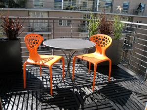 Vibrant Orange Chairs and Gray Balcony
