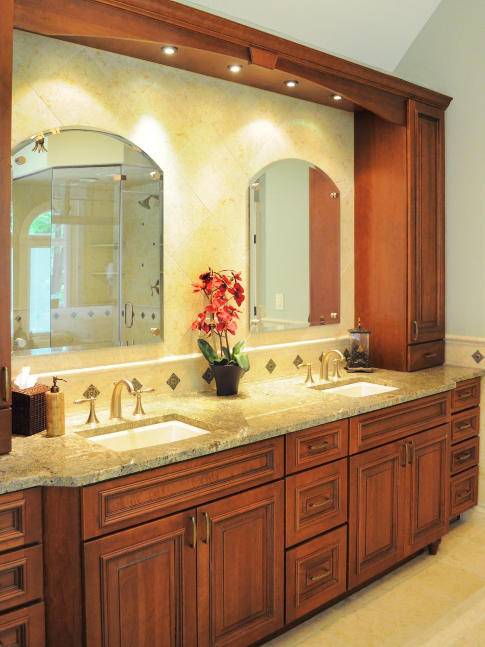 Traditional Bathroom With Double Wooden Vanities and Tile Backsplash