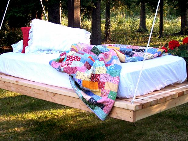 Hanging Outdoor Daybed With Multicolored Quilt Hanging Outdoor Daybed With Multicolored Quilt