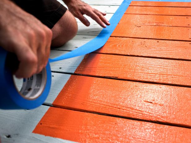 Painter's Tape Around Orange Painted Rug Border