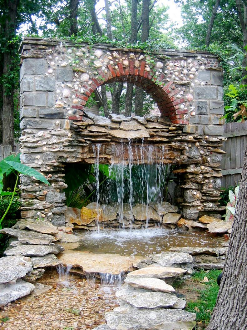 Outdoor Brick and Stone Structure with Natural Waterfall 