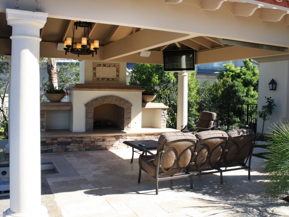Outdoor Living Room With Fireplace and Stone Patio