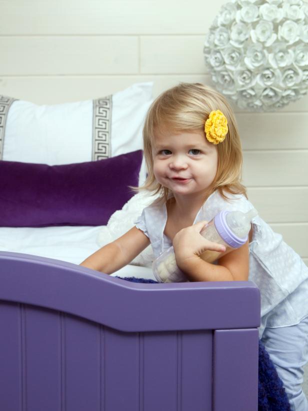 Girl Leaning Against Purple Bed Girl Leaning Against Purple Bed